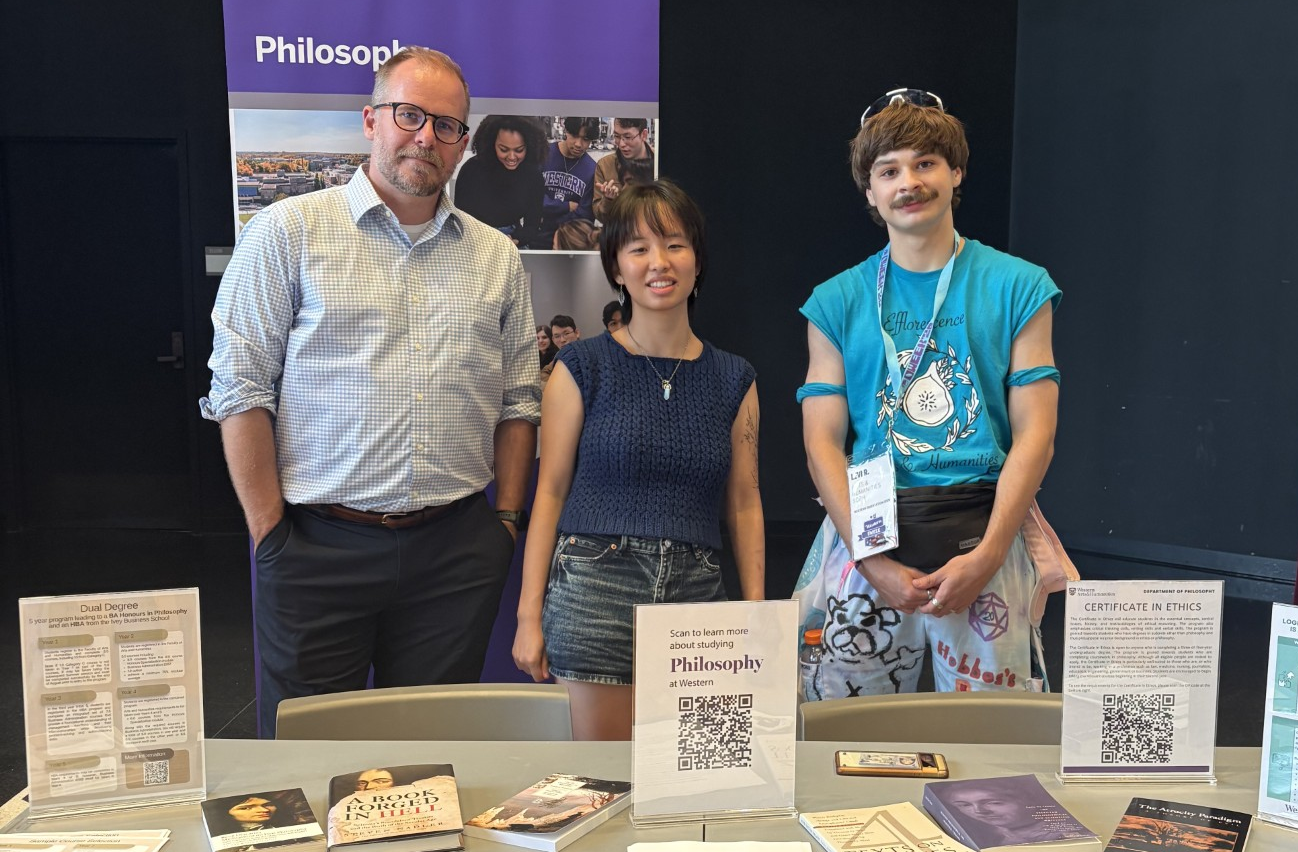 Students and volunteers at the Department of Philosophy booth during Fall Faculty Day.