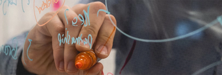 Hand writing on a whiteboard