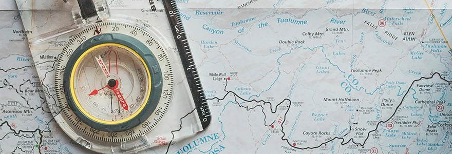 A clear compass on a map