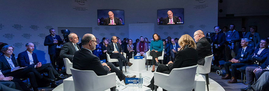 People speaking in a televised round table environment