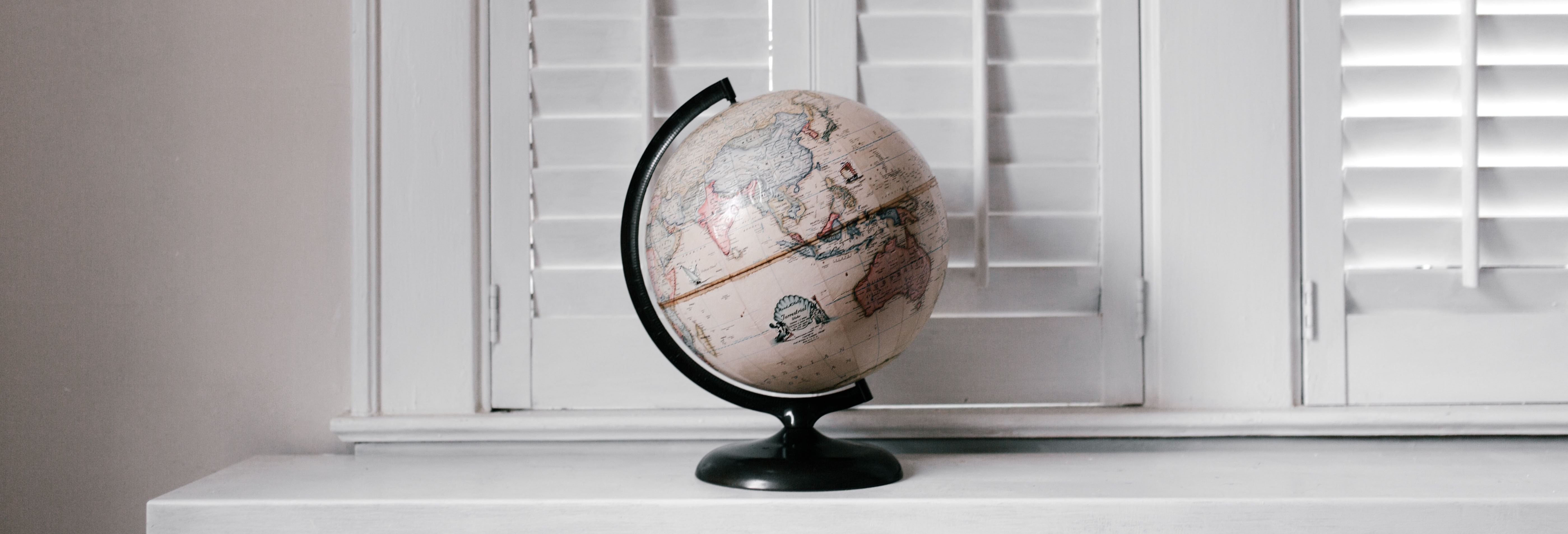 Image of a globe, sitting on a shelf. Decorative.