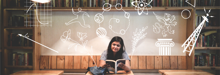 student reading in a coffee shop with various ideas floating above her head