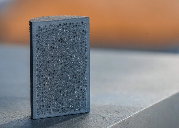 Fully ceramic microencapsulated (FCM) fuel pellet containing TRISO fuel particles (USNC)