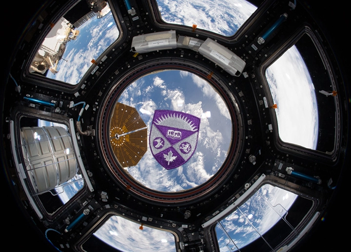 western crest on viewport of the international space station