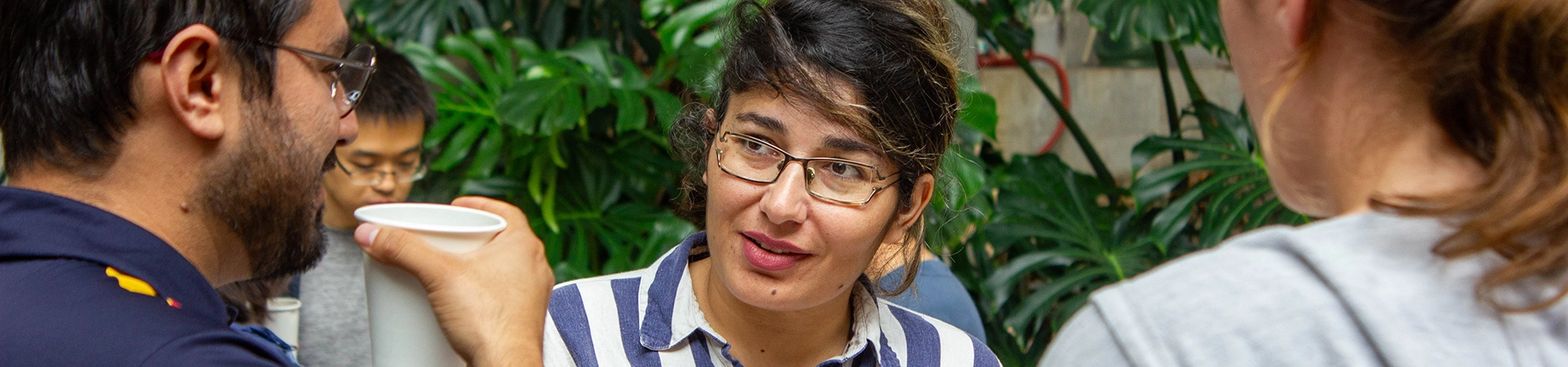 Postdoctoral scholars talking at lunch