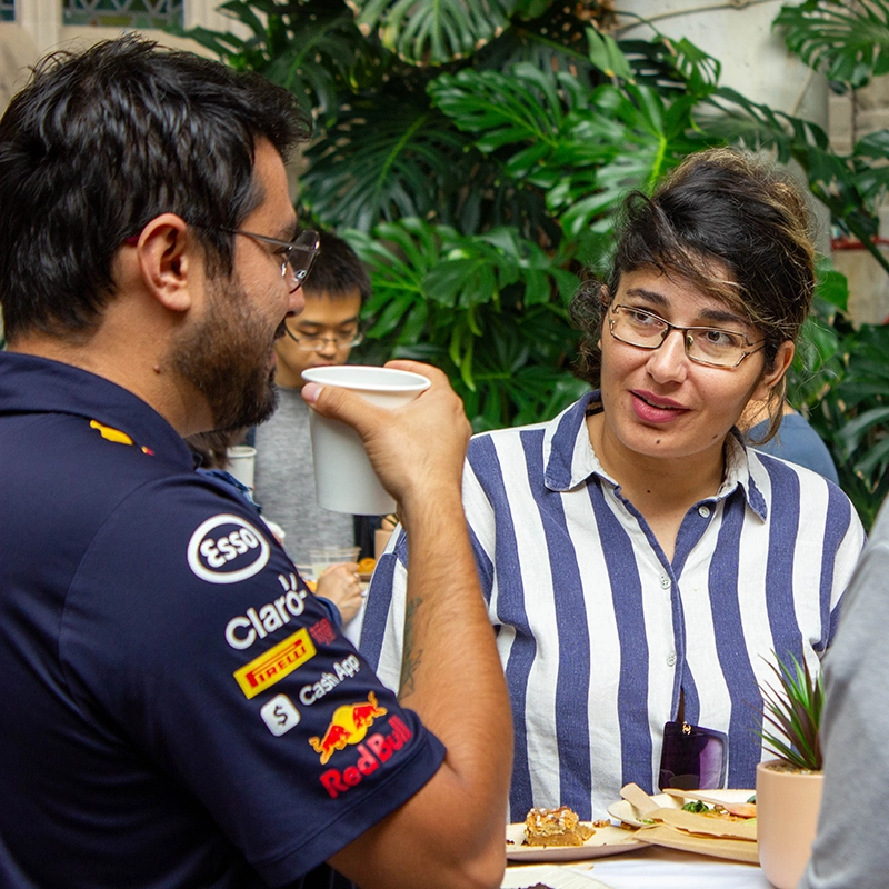 Postdoctoral scholars talking at lunch