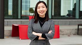 Student in front of building