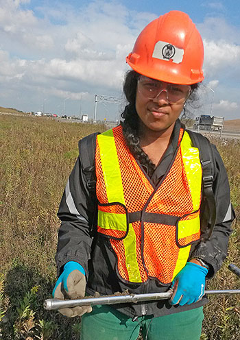 Nimaika Weerasuriya collecting soil samples for her graduate work.