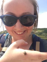 Jackie Lebenzon holding a creepy crawly.