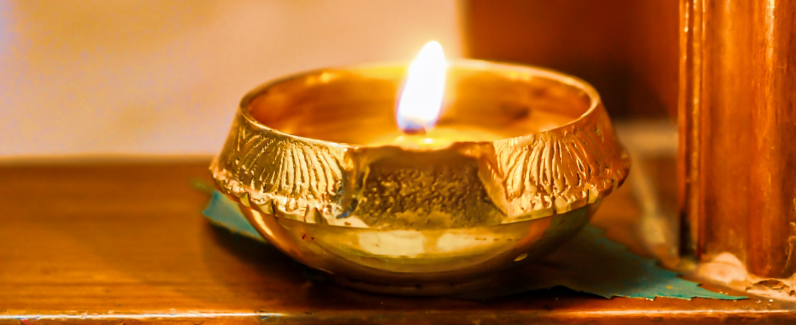 An oil candle lit in celebration of Diwali