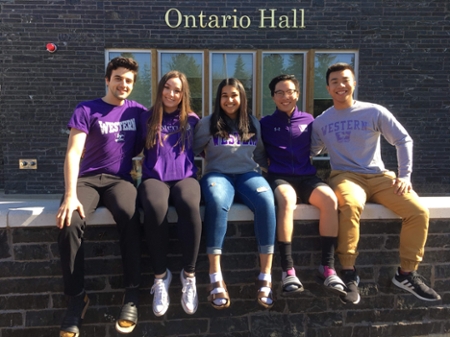 Picture of Evan with his floormates in front of Ontario Hall.