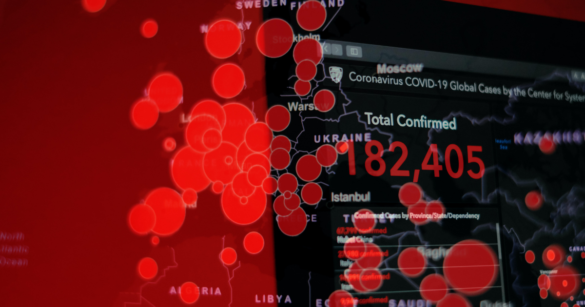 A computer screen displaying the total number of worldwide COVID-19 cases