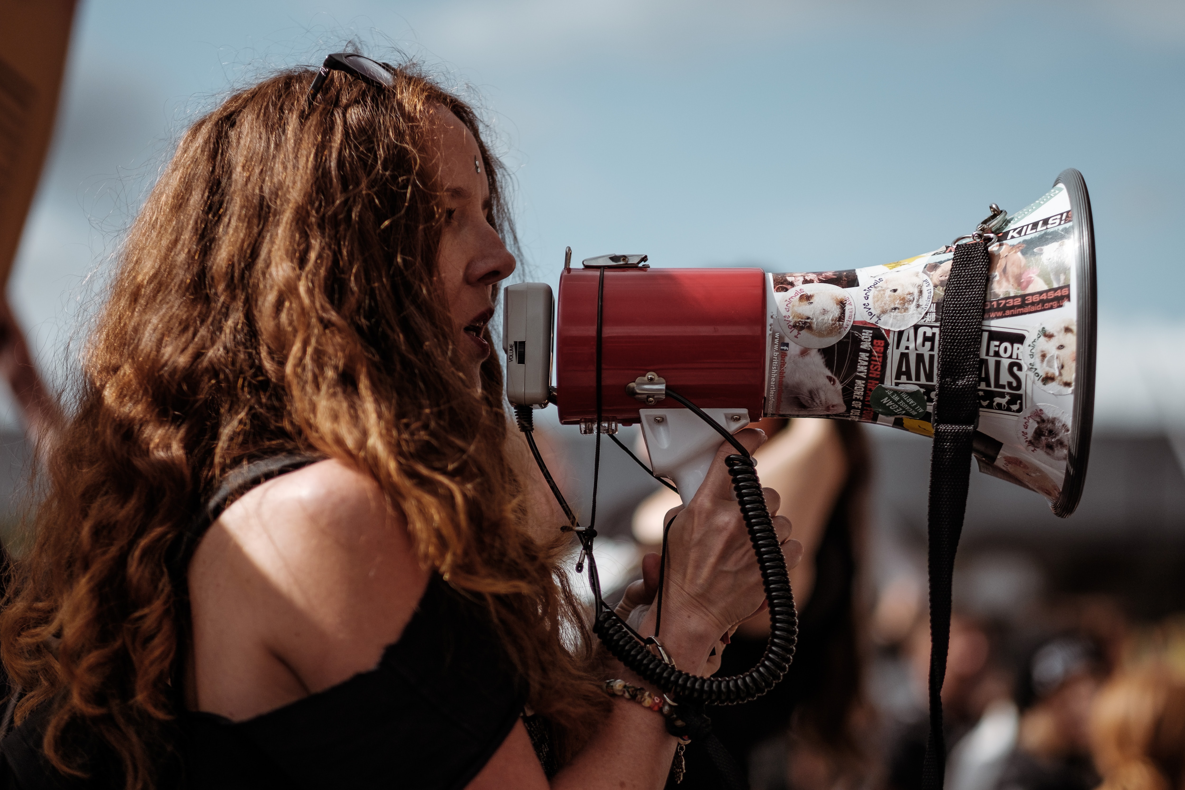 A girl shouting through a megaphone.