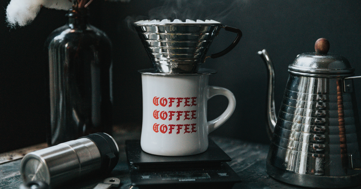 A photo of a coffee mug undeneath a drip coffee maker