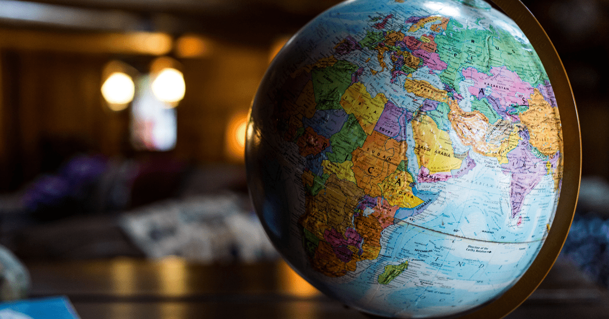 A close up photo of a globe on a table