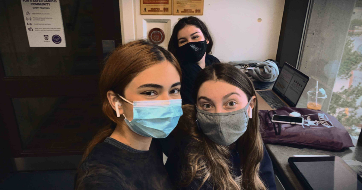 A photo of Amjali and her friends, all wearing masks on campus