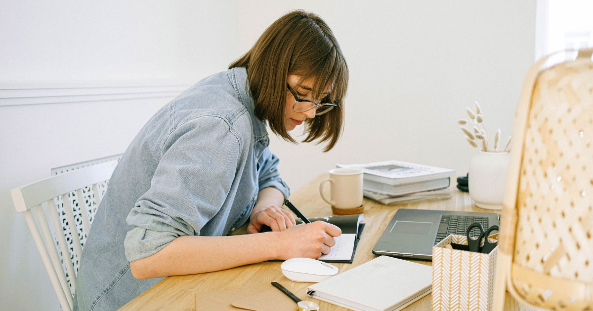 A woman sitting at a desk at work