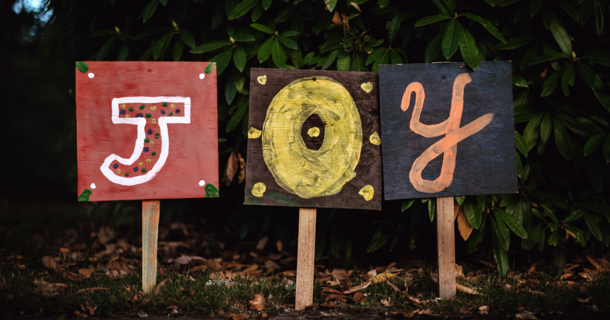 A sign with big letters reading JOY