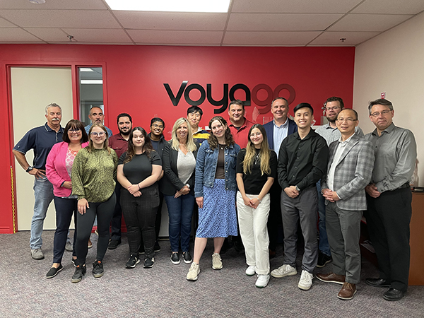 Sam with the Voyago team