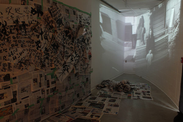 Yes/No installation view, video projection and paper/text installation