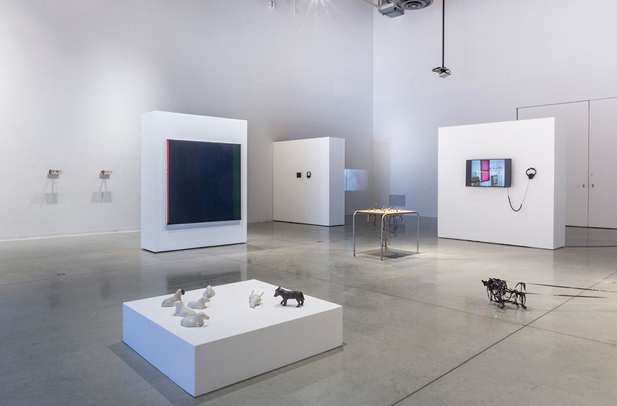 Installation view of exhibition showing a variety of sculptural and wall works