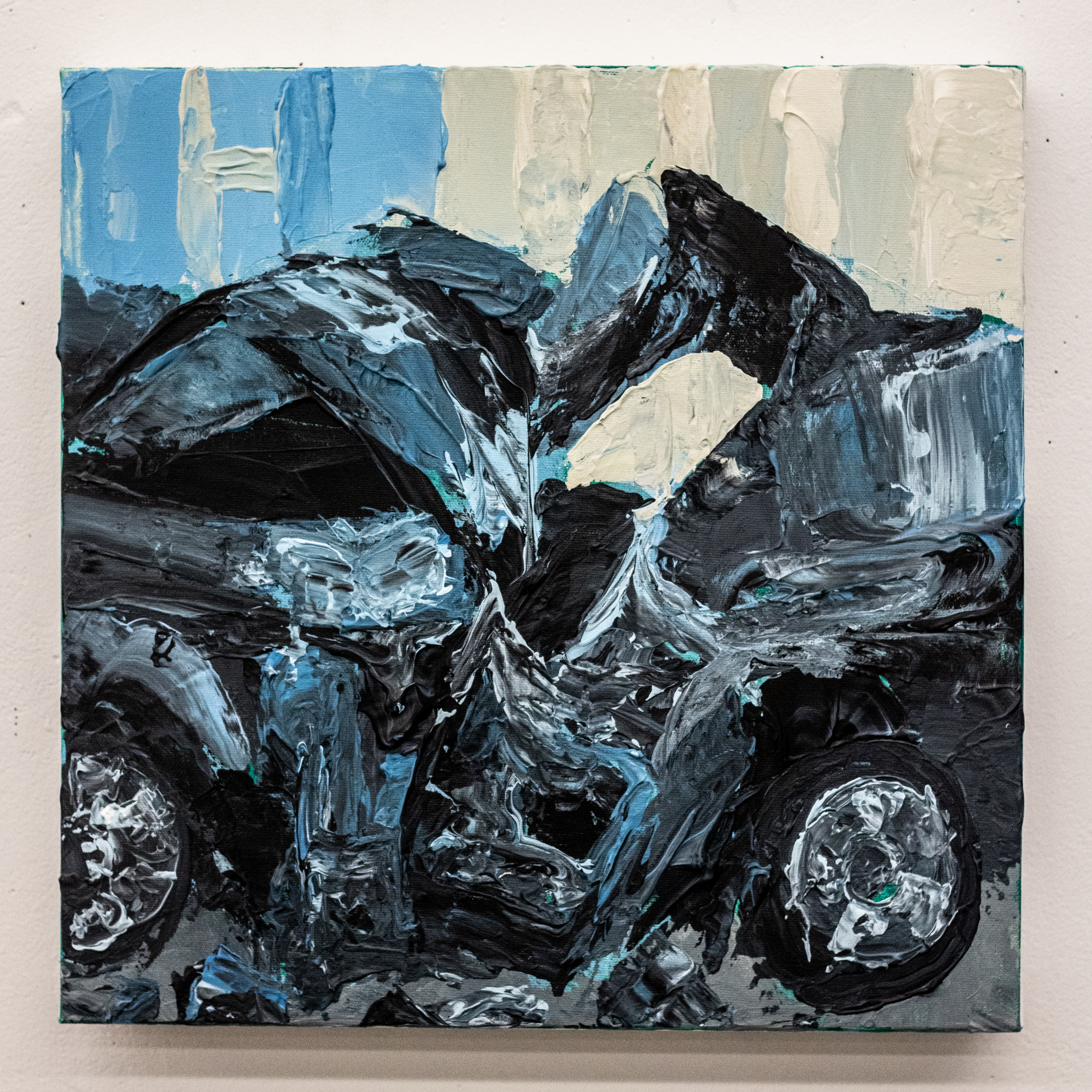 Painting of a crumpled car in blue, black, and white.