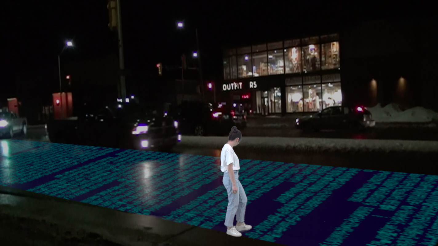 Photo of a figure standing on a line of information occupying a lane of traffic with an urban street behind them.